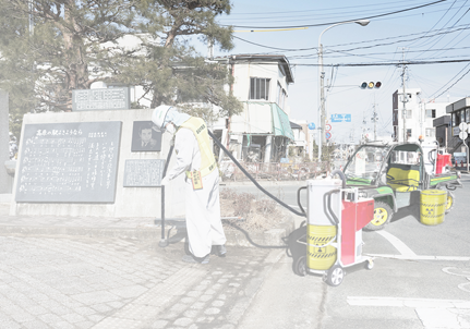 Vacuum nuclear waste clean-up vehicle equipped with two nuclear waste drums and an industrial vacuum cleaner.