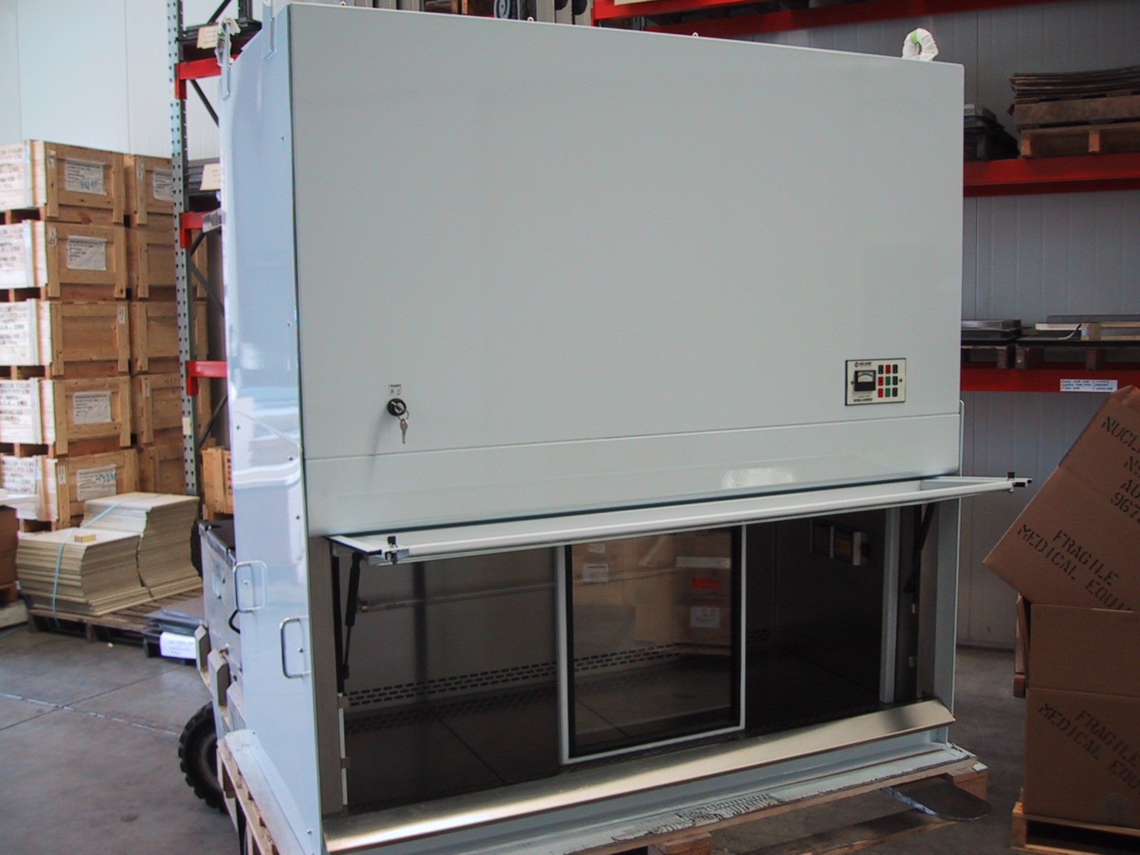 Lead lined fume hood with sliding lead glass viewing window.