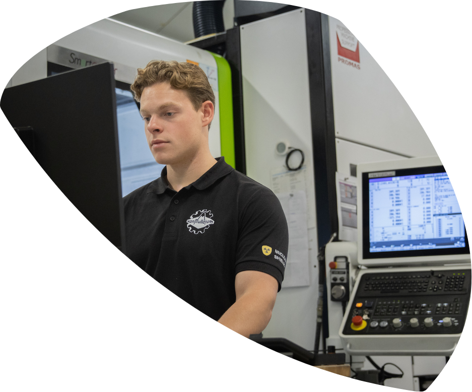 Man operating a machine in workshop