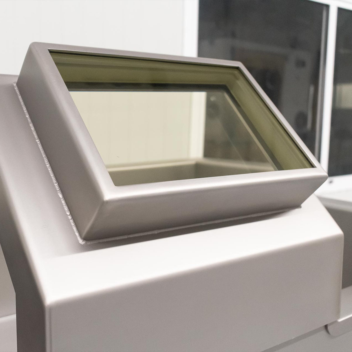 lead glass viewing window installed inside radiation shielded workstation